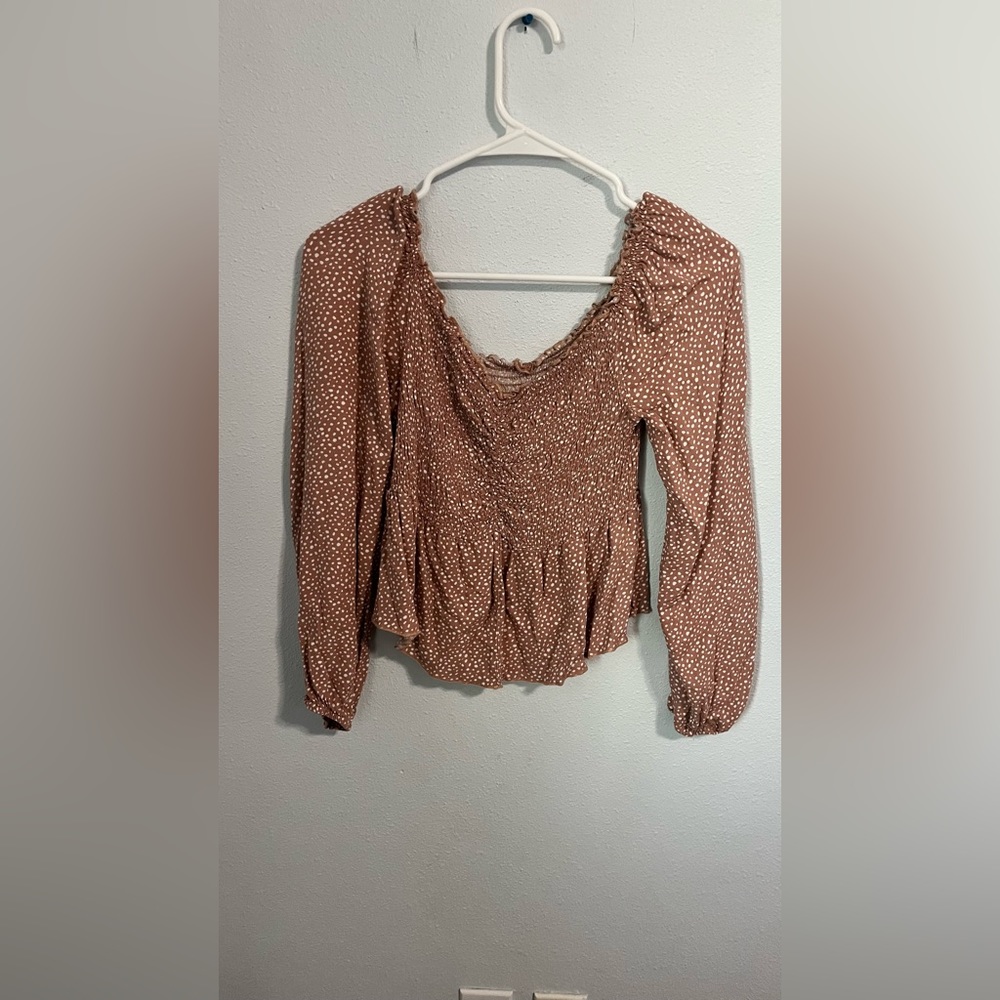 Women’s ruched polka dotted blouse